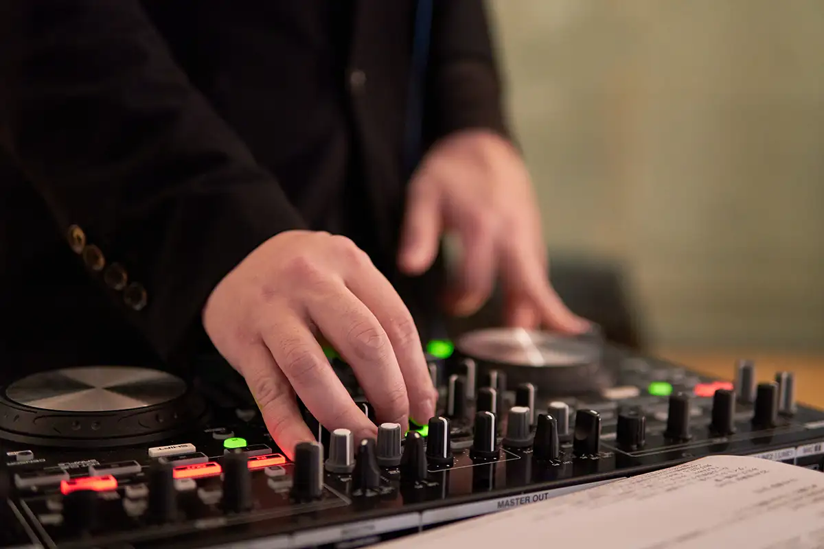 DJ operating the mixer at an event